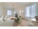 Bright living room with hardwood floors, fireplace, and stylish furnishings at 715 W 7Th Ave, Denver, CO 80204
