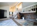 Spacious living room with high ceilings, loft area, and hardwood floors at 974 S Zeno Way, Aurora, CO 80017