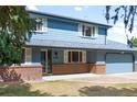 Charming two-story home boasts a welcoming entrance and an attached two-car garage at 12579 Appaloosa Pl, Broomfield, CO 80020