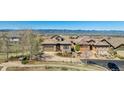 Charming stone home with a well-manicured front yard and a mountain view at 10731 Featherwalk Ln, Highlands Ranch, CO 80126
