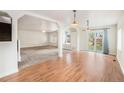 Bright, open-concept living area with hardwood floors, and lots of natural light at 309 Lincoln Ave, Platteville, CO 80651