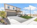 Inviting two story home with a covered porch, two-car garage and a manicured lawn at 4338 Cattle Cross Trl, Castle Rock, CO 80104