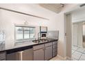 Modern kitchen featuring stainless steel appliances and granite countertops at 14110 E Temple Dr # X02, Aurora, CO 80015