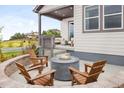 Cozy outdoor seating area featuring a stone fire pit perfect for relaxing evenings and entertaining guests at 138 S Seacrest St, Golden, CO 80401