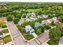 A beautiful neighborhood with mature trees and landscaping; the home has a neatly maintained yard at 823 Timothy Dr, Longmont, CO 80503