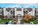 Charming condo building with well-maintained landscaping and inviting entrance at 491 S Kalispell Way # 305, Aurora, CO 80017