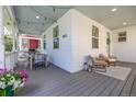 Spacious back porch with outdoor seating and dining area at 3433 N Wabash St, Denver, CO 80238
