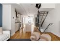 Modern kitchen with island and stainless steel appliances at 1836 Grove St # 107, Denver, CO 80204