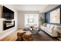 Open living space with fireplace and ample natural light at 1836 Grove St # 107, Denver, CO 80204