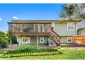 View of a two story home featuring a wooden deck at 18771 Mexico E Dr, Aurora, CO 80017