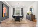 Refined dining room with modern lighting, a stylish table, and elegant decor for sophisticated entertaining and Gathering dinners at 4960 Malaya St, Denver, CO 80249