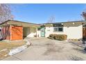 Mid-century modern home with a light-colored facade at 1488 S Fairfax St, Denver, CO 80222