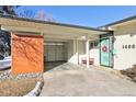 Covered entryway with a teal door and modern design at 1488 S Fairfax St, Denver, CO 80222