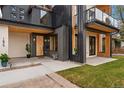 Contemporary home featuring a striking black and white facade, sleek lines, and modern design at 1675 S Steele St, Denver, CO 80210