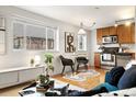 Modern kitchen with stainless steel appliances and wood cabinets at 1419 Detroit St # 25, Denver, CO 80206