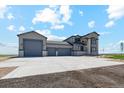 Beautiful two-story home with a three-car garage and wide concrete driveway at 2990 S Juliet Ct, Strasburg, CO 80136