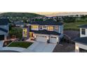 Stunning two-story home with a three-car garage, fenced in yard, and mountain views at 423 Rogers Way, Castle Rock, CO 80104