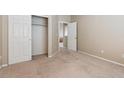 Spacious bedroom with carpet, closet, and a neutral wall color at 13756 Legend Trl # 101, Broomfield, CO 80023