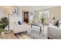 Cozy living room showcases neutral tones, stylish decor, and an inviting atmosphere at 6768 Vivian St, Arvada, CO 80004