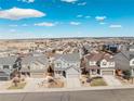 An aerial view of a neighborhood with various homes showcasing the community's layout and surroundings at 7686 Grady Cir, Castle Rock, CO 80108