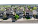 Suburban home showcasing neighborhood with tree-lined streets and beautiful landscaping at 7686 Grady Cir, Castle Rock, CO 80108