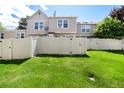 Spacious backyard with a well-maintained lawn and a privacy fence, perfect for outdoor activities at 9713 W Chatfield Ave # F, Littleton, CO 80128