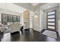 Bright living room featuring dark hardwood floors, a stone fireplace, and ample seating at 350 15Th St, Boulder, CO 80302
