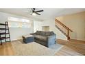 Cozy living room with modern flooring and a comfortable couch at 371 Smith Cir, Erie, CO 80516