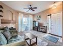 Cozy living room featuring a fireplace and access to a private balcony at 3230 Boulder Cir # 101, Broomfield, CO 80023