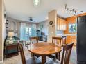 Open concept kitchen and living space with a breakfast nook and ceiling fan at 3230 Boulder Cir # 101, Broomfield, CO 80023