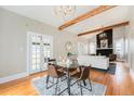 Dining room with hardwood floors with French doors leading to the backyard at 5326 Lowell Blvd, Denver, CO 80221