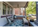 Cozy front porch with comfortable seating and stylish decor at 1844 S Lincoln St, Denver, CO 80210