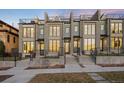 Modern townhomes with stone accents, large windows, and well-maintained landscaping at 556 Monroe St, Denver, CO 80206