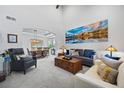 Bright living room featuring high ceilings and an open-concept layout at 11935 E Lake Ct, Greenwood Village, CO 80111