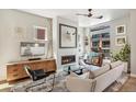Bright living room features fireplace, large windows, and modern decor at 1012 Bannock St, Denver, CO 80204