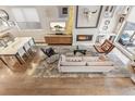 Bright, modern living room featuring a fireplace, comfortable seating, and an area rug at 1012 Bannock St, Denver, CO 80204