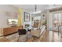Cozy living room with fireplace, entertainment center and stylish decor at 1012 Bannock St, Denver, CO 80204