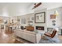 Open-concept living space with hardwood floors and a modern fireplace at 1012 Bannock St, Denver, CO 80204