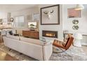 Contemporary living room featuring a fireplace and stylish decor at 1012 Bannock St, Denver, CO 80204