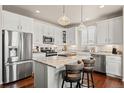 Modern kitchen with stainless steel appliances, island, and granite countertops at 5900 Haywagon Ln, Castle Rock, CO 80108
