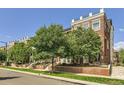 Attractive townhome exterior, lined with trees and offering a welcoming curb appeal at 3411 N Xenia St, Denver, CO 80238