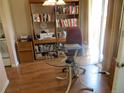 Office space with natural light, hardwood flooring, and plenty of storage at 8781 N Pierce Way # 102, Arvada, CO 80003