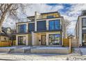 Contemporary two-story townhomes with stone facade, dark accents, and rooftop decks at 374 S Humboldt St, Denver, CO 80209