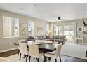 Cozy living room area with a fireplace, lots of natural light, and comfortable seating arrangements at 3887 Grand Baker St, Aurora, CO 80019