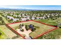 Stunning aerial view of a sprawling estate, complete with a home and large lot at 6191 S Olathe St, Centennial, CO 80016