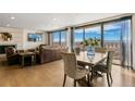 Open-concept dining area with scenic views and an elegant dining set at 1020 15Th St # 42A, Denver, CO 80202
