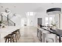 Open concept dining room with modern table and chairs at 9385 E 58Th Dr, Denver, CO 80238