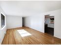 Spacious living room with gleaming hardwood floors and plenty of natural light at 945 W 8Th Avenue Dr, Broomfield, CO 80020