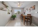 Bright dining room with wooden table, chairs, and large window at 8798 Chase Dr # 4, Arvada, CO 80003