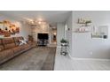 Cozy living room with wood accent wall, soft lighting, and comfortable seating at 8798 Chase Dr # 4, Arvada, CO 80003